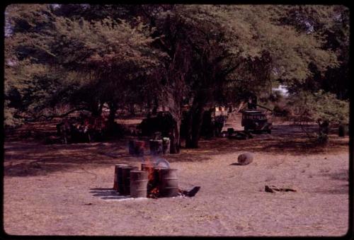 Barrels over fire to boil water