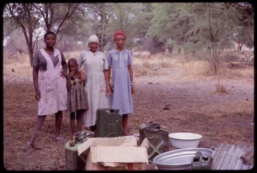 Three women and a girl who did laundry for the expedition