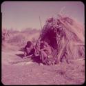 Groups, "Nuclear Family": //Ao (son of "Old ≠Toma") sitting with his wife, ≠Nisa, in front of their skerm