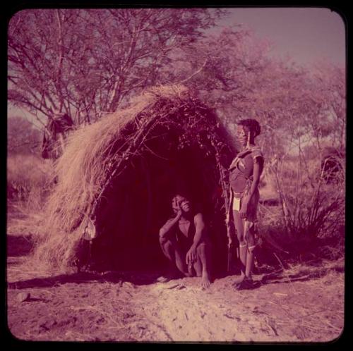 Marriage: Bau standing next to Tsamgao sitting, in front of a skerm