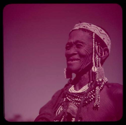 Portraits: "Old /Gam" wearing ornaments, including cowrie shells and a headdress of European beads