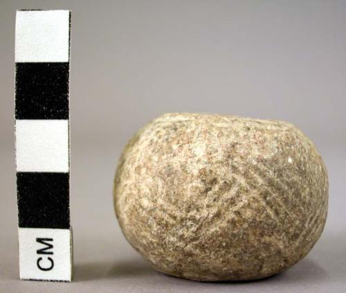 Spindle whorl with incised geometric design 4.3 cm diameter x 3.1 cm. h.