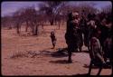 Group of women dancing, and N//aba's daughter imitating the dancers