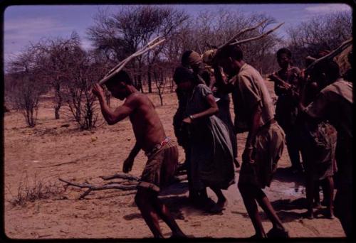 /Gaishay and Tchobe, the husband of ǂKxoba, wearing horns and dancing, performing the Eland Dance