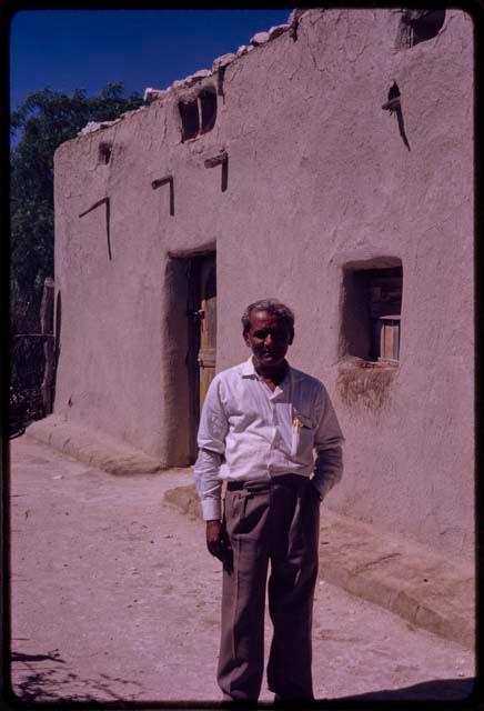 Rasool standing in front of a building