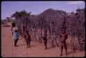 Children standing in front of the fence of their kraal