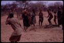 N//aba leading the Eland Dance, with men wearing horns