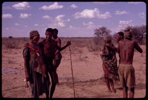 Group of people performing a social dance, including /Gaishay dancing with N/kxabe (wife of another /Gaishay), /Xoxa dancing with "Old Sãõ?//e"