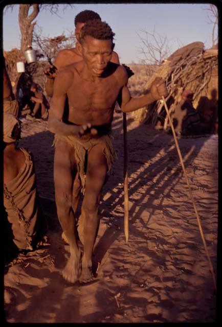 /Xoxa performing a curing dance, with other people in the background