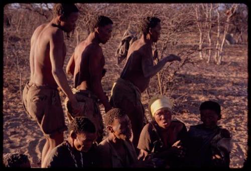 /Xoxa, /Gaishay, and Tama performing a curing dance around a group of women sitting in a circle