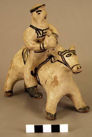 Rider and horse modeled in clay, white and black