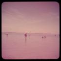 Scenery: Children standing in shallow water in a pan