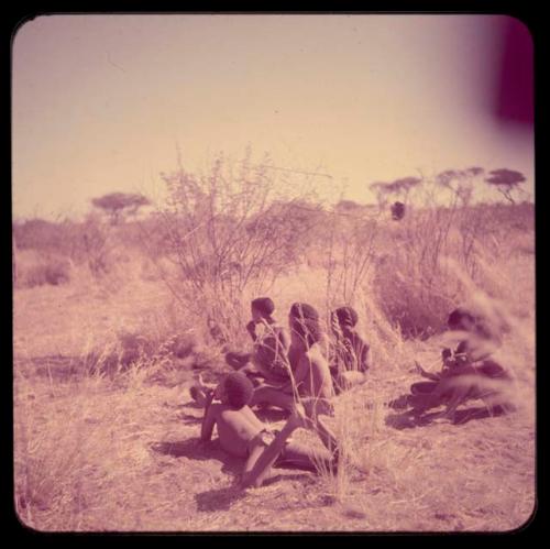 Group of boys sitting in the grass