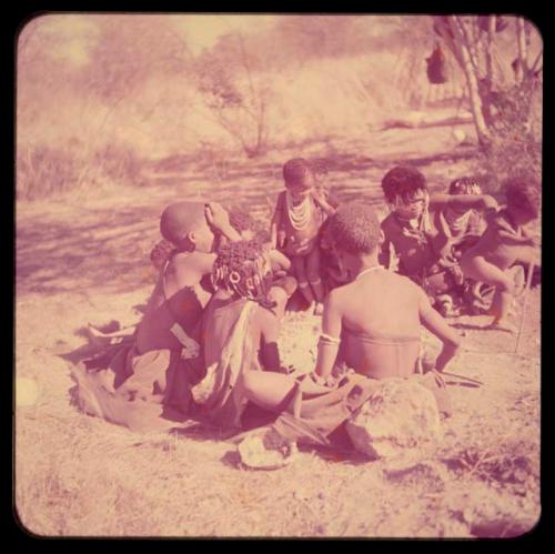 Group of women and children sitting together for a choa ceremony