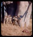 Expedition members (John Marshall, Picanin, Christophe, Katugua, Lorna Marshall, and Robert Dyson) standing near a baobab tree