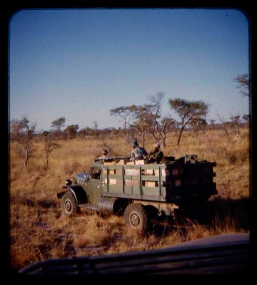 Sarah and Katambaye riding in an expedition truck on their way from Gautscha to Cho/ana