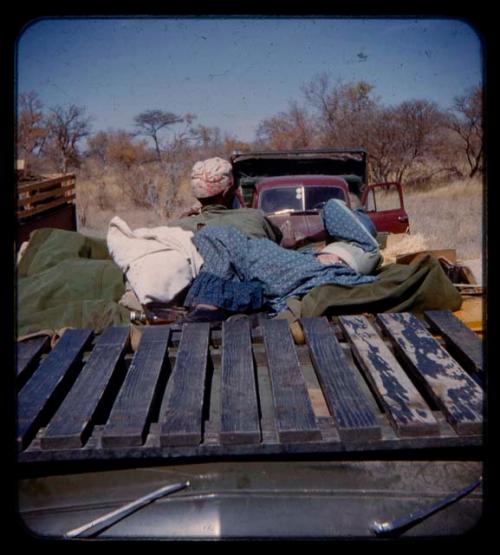 Sarah and Katambaye riding in an expedition truck on their way from Gautscha to Cho/ana