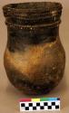 Ceramic vessel, slightly flared & punctate neck, shell temper, rounded base.