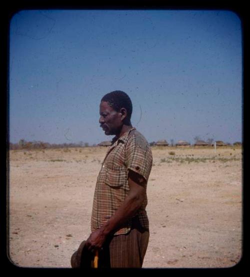 Man standing, in profile