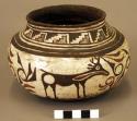 Jar, brown and red geometric curvilinear and animal design on cream