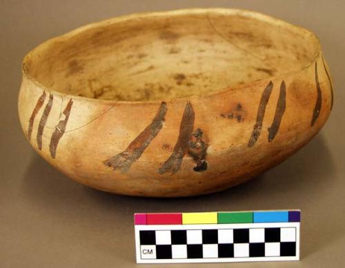 Ceramic bowl, cream and orange exterior, mottled interior, steep walls