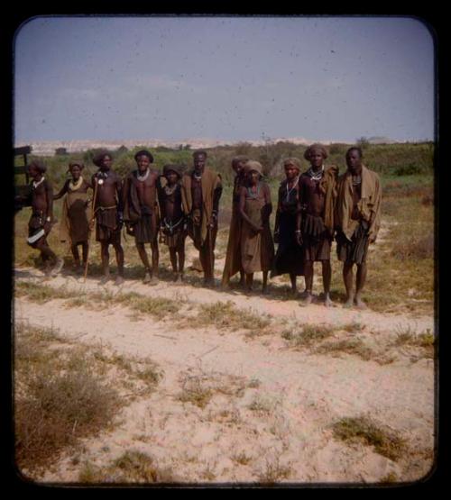 Group of people standing in a line at the Curoca Valley