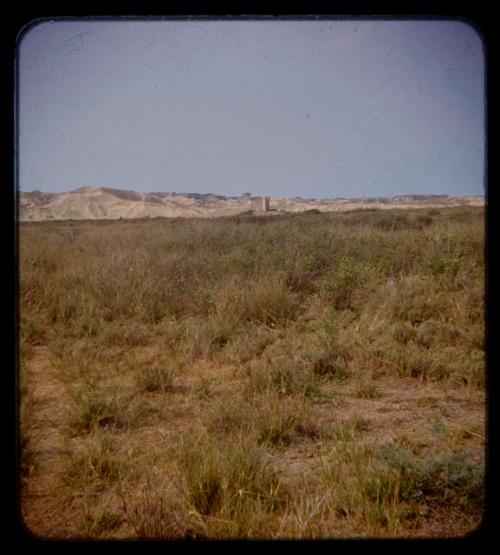 Rock formation or wall, distant view