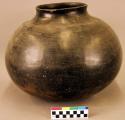 Large pottery olla. Globular, short neck, slightly outcurved rim, small orifice