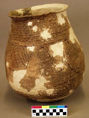 Corrugated jar with incised line and punctate designs on a smoothed band