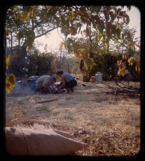 Carey McIntosh and Elizabeth Marshall Thomas cooking at expedition camp