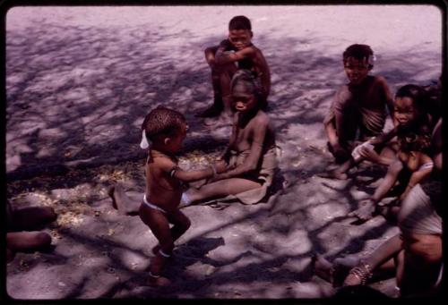 Children sitting at expedition camp