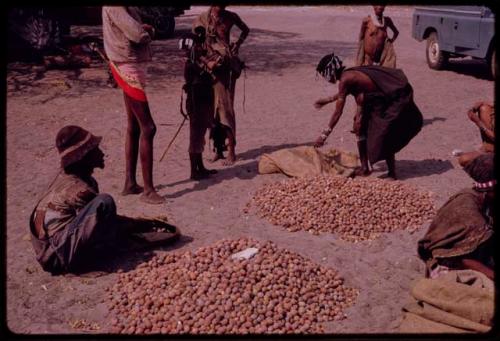 "Gao Medicine" and other people beside their nuts, his first wife, /Naoka, is standing in the background