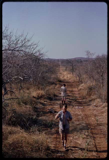 Nicholas England and C.J. Mathias walking down a road