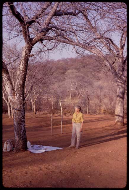 Lorna Marshall standing at expedition camp