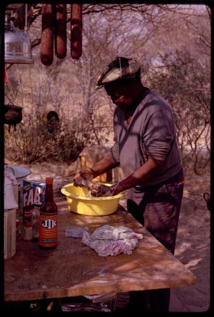 Philip Hameva cooking at expedition camp