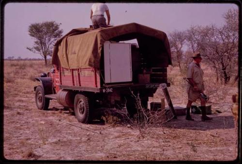 Expedition members unloading the expedition Red Dodge truck