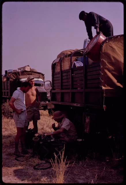 Expedition members unloading the expedition trucks