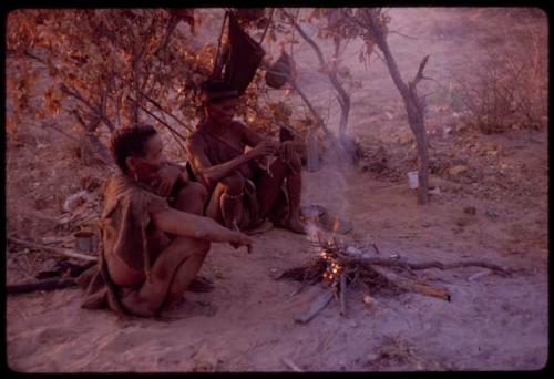 "Old D/ao" and his wife sitting by their fire