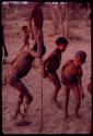 Boys dancing, one boy wearing rattles on his legs