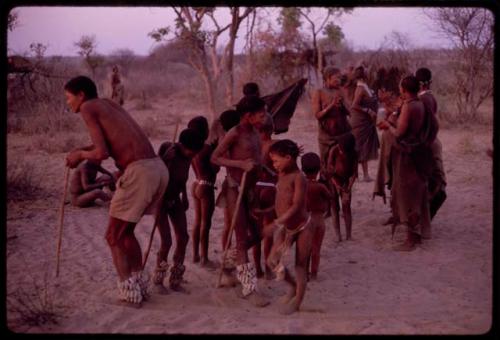 People gathering for a curing dance, ǂToma circling the women