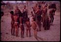 People in a circle, clapping and dancing