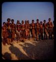 Group of women and children standing in a row