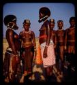 Women standing, wearing Vahimba headdresses