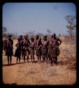 Group of people standing by a road