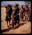 Group of people standing by a road