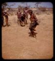 Woman dancing and people watching and clapping