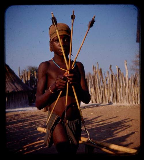 Boy holding three arrows