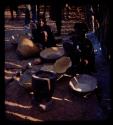 Women sifting corn