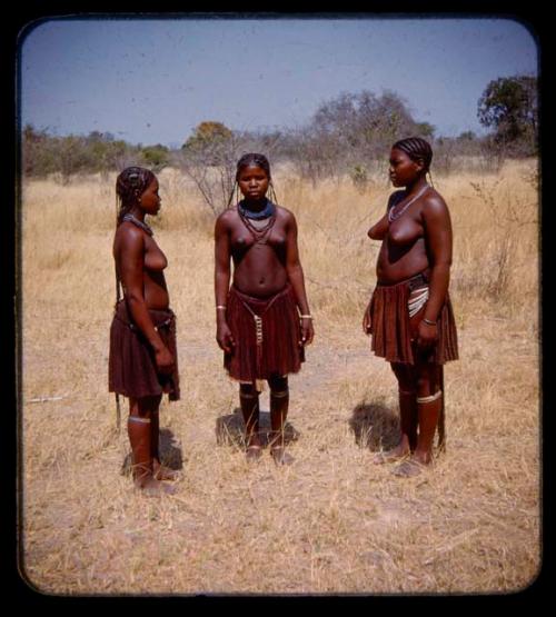 Three girls standing in a circle