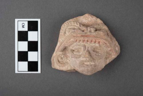 Pottery figurine head with bud head headress